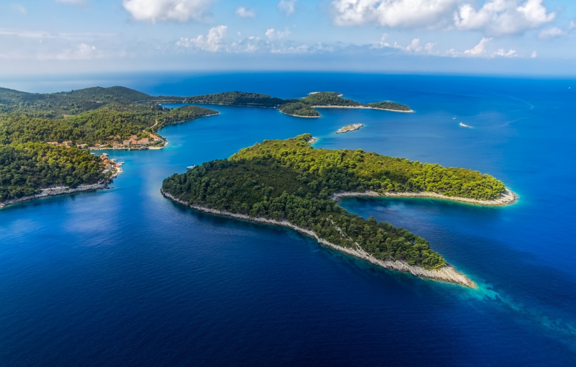 'Aerial helicopter shoot of National park on island Mljet, village Pomena, Dubrovnik archipelago, Croatia. The oldest pine forest in Europe preserved.' - Dubrownik